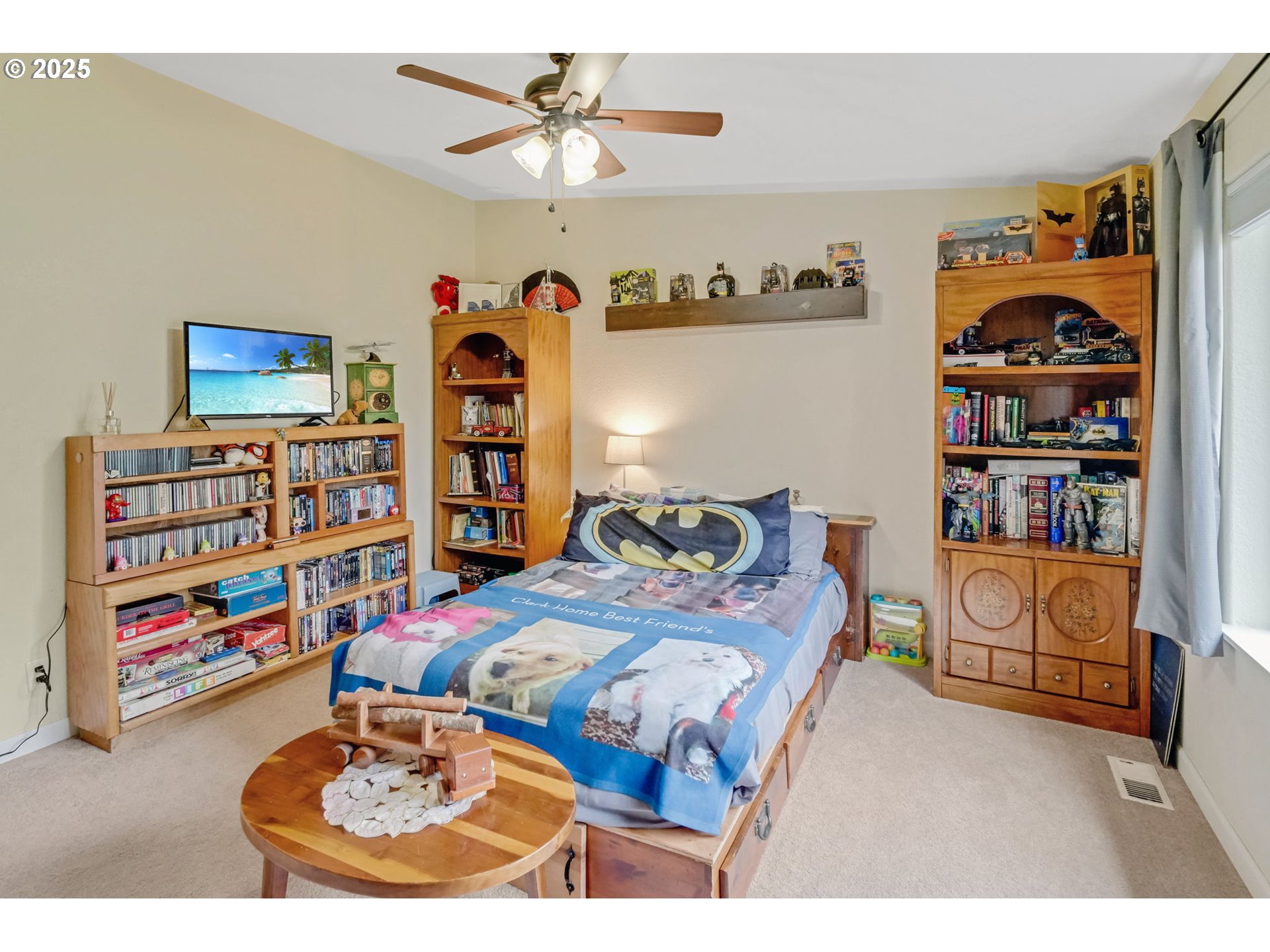 171 Car Road Longview, WA 98632 - Photo 22 of 45 a bedroom with a bed a books and a shelf