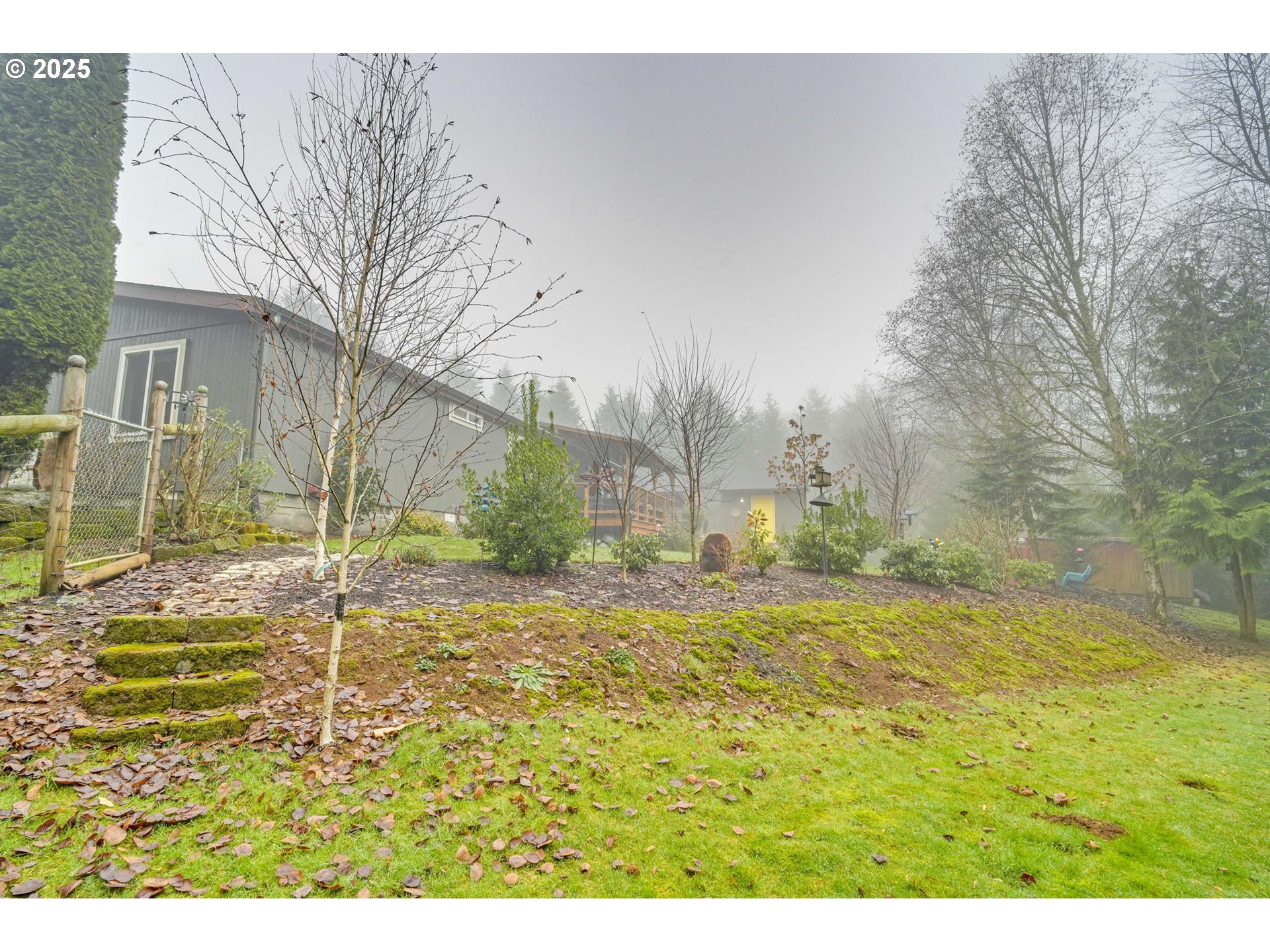 171 Car Road Longview, WA 98632 - Photo 30 of 45 a view of a garden with a building