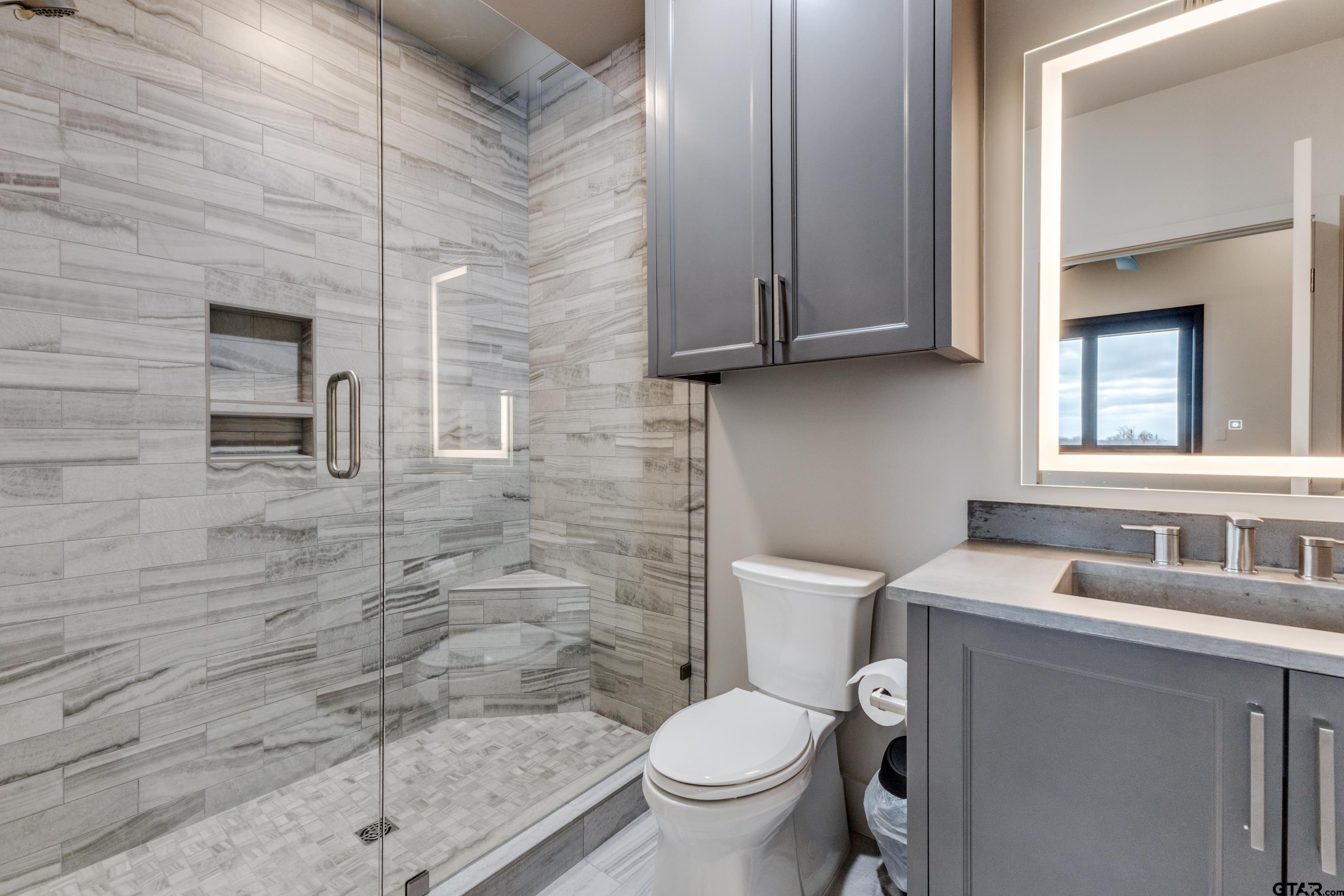 900 West Fm Saltillo, TX 75478 - Photo 13 of 36 a bathroom with a toilet a sink and mirror