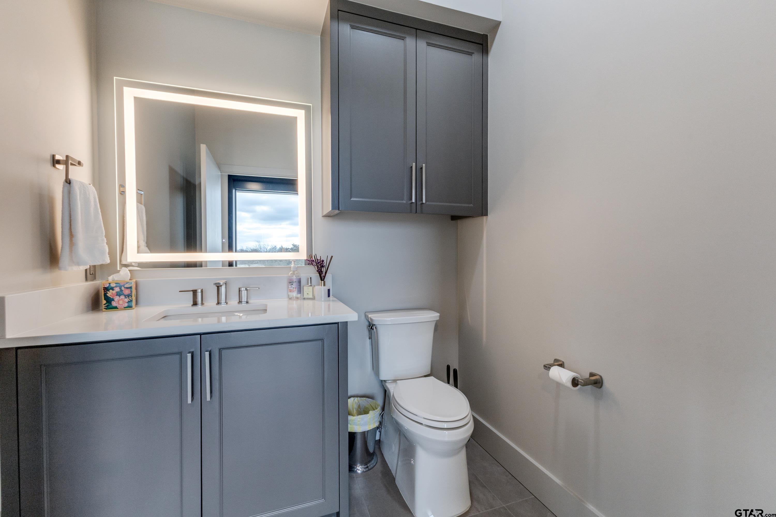 900 West Fm Saltillo, TX 75478 - Photo 14 of 36 a bathroom with a toilet sink and mirror