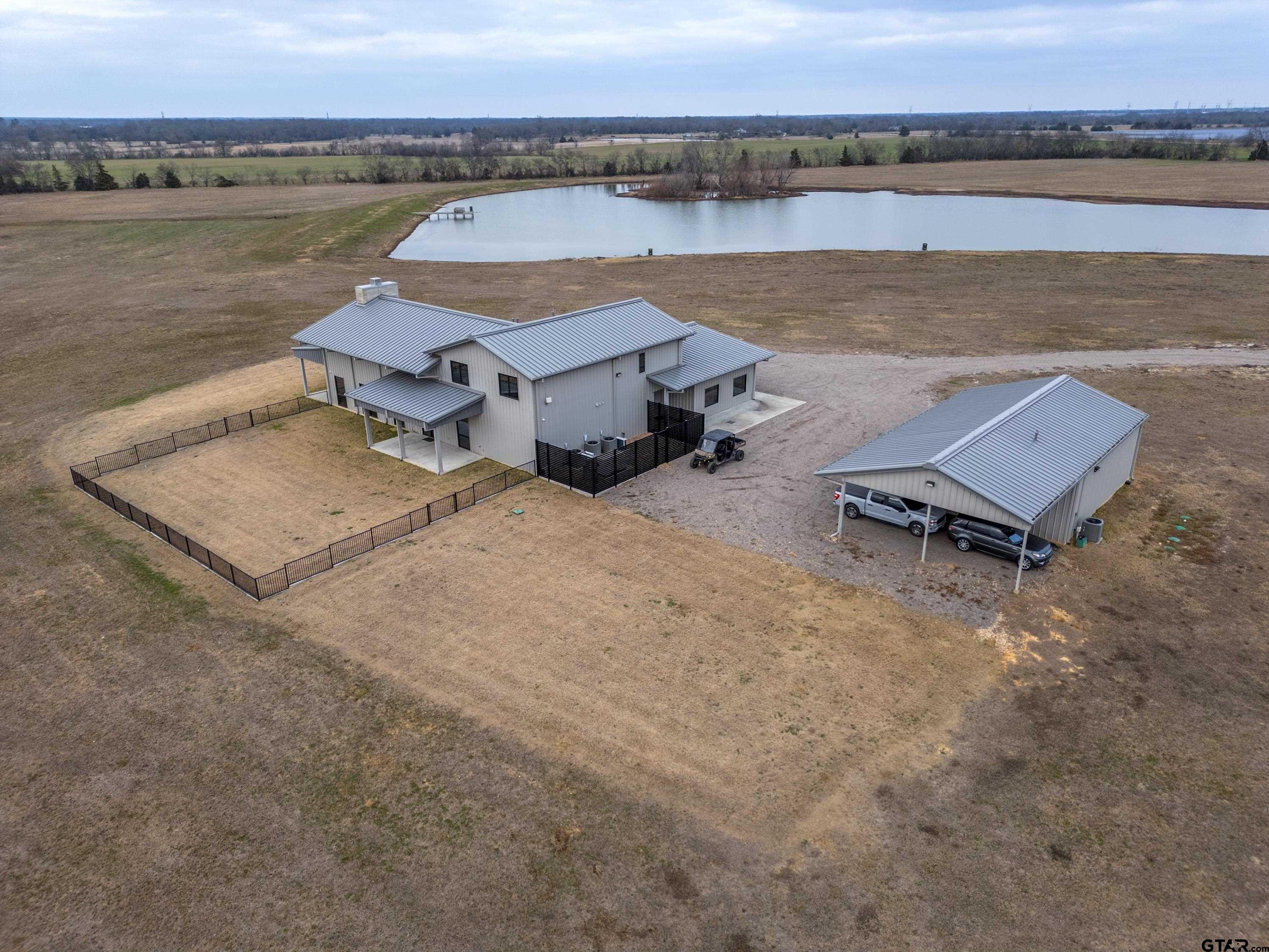 900 West Fm Saltillo, TX 75478 - Photo 16 of 36 an aerial view of a house with a lake view