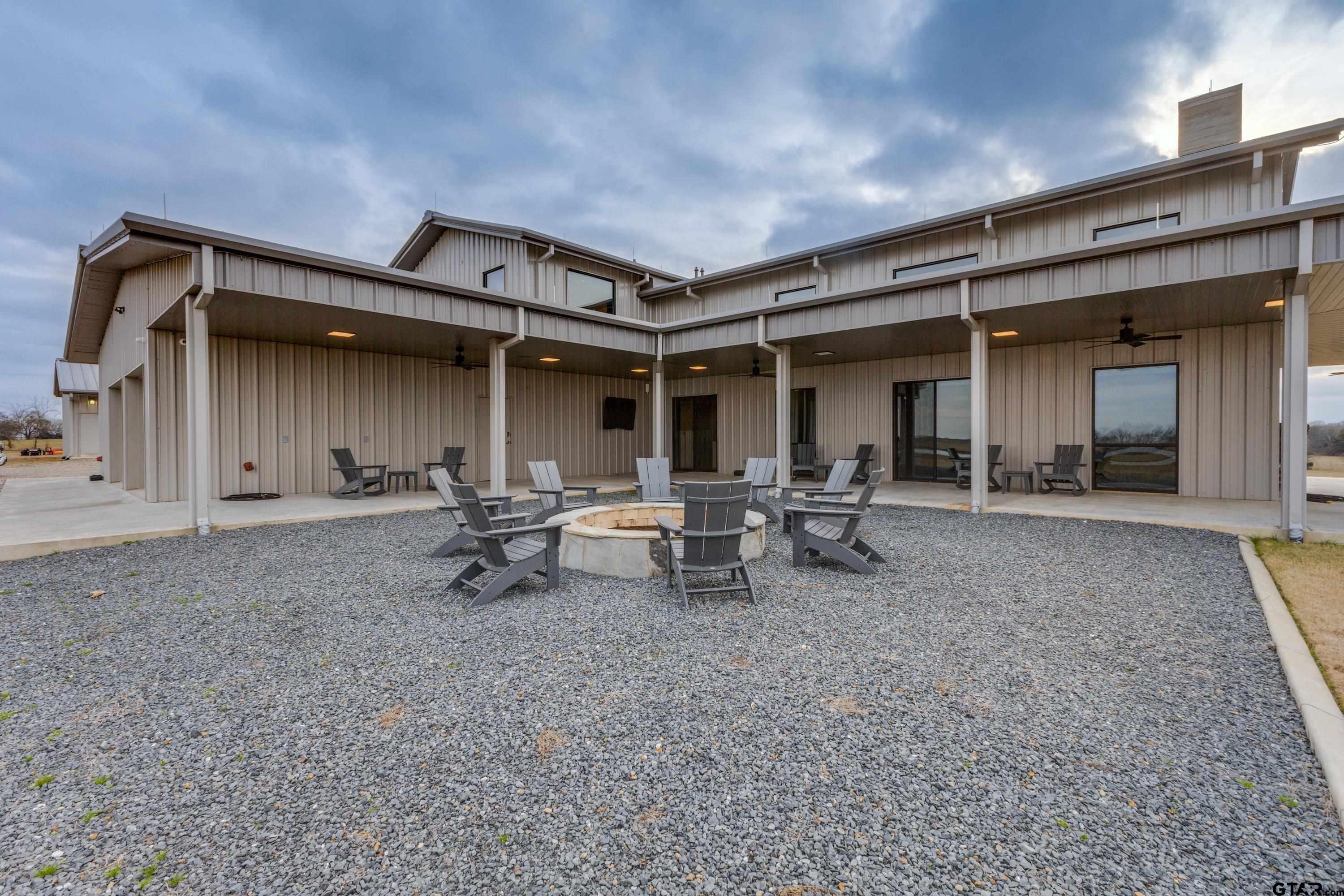 900 West Fm Saltillo, TX 75478 - Photo 23 of 36 a view of a patio with table and chairs and potted plants