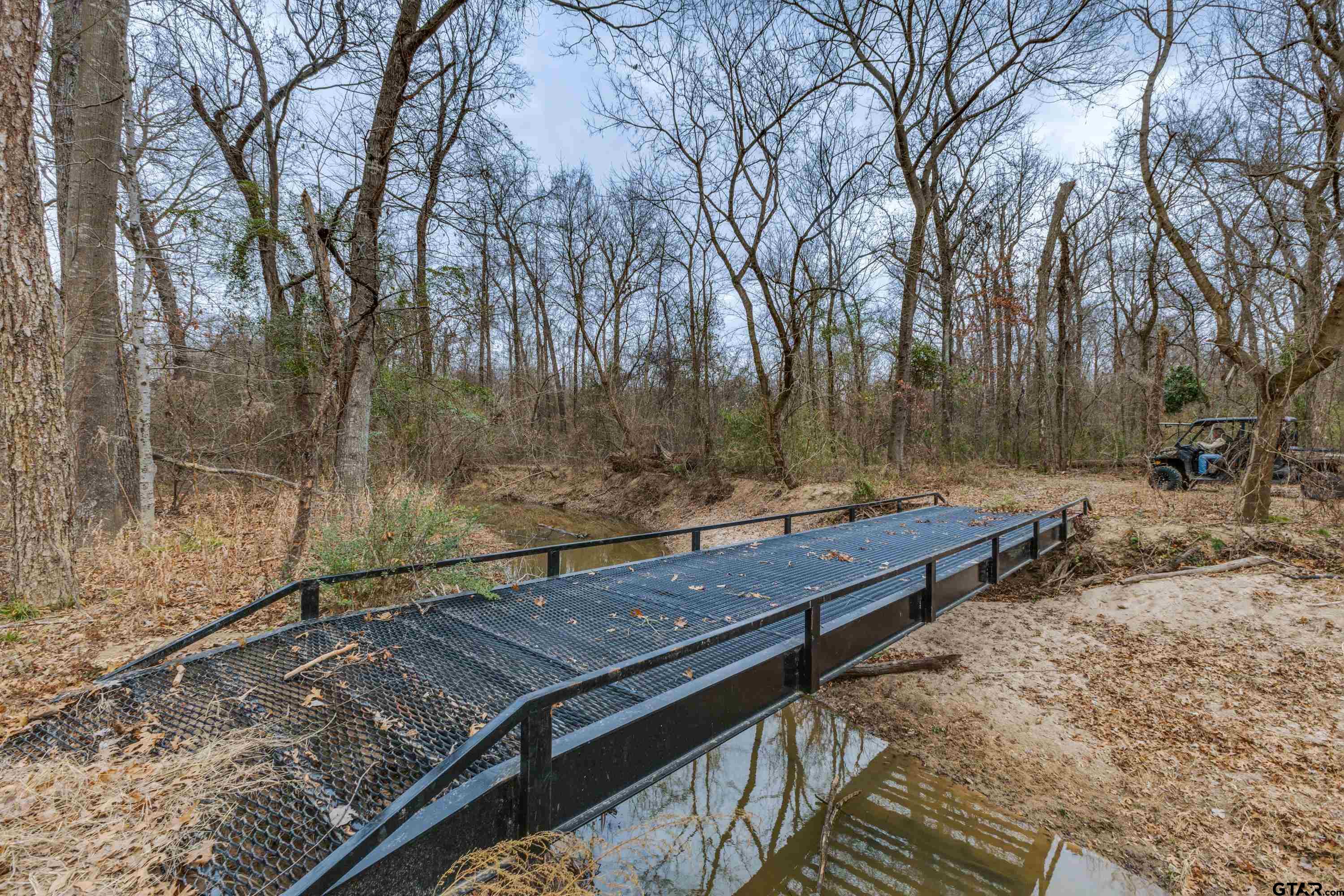 900 West Fm Saltillo, TX 75478 - Photo 30 of 36 a view of a wooden floor with a bench