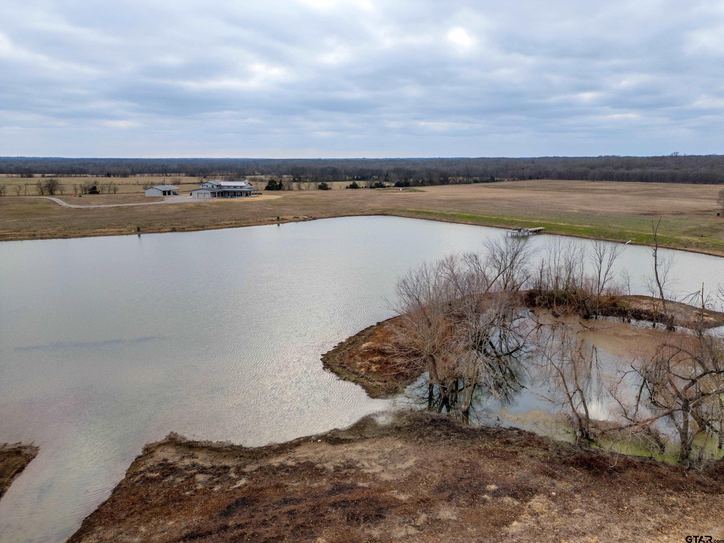 900 West Fm Saltillo, TX 75478 - Photo 33 of 36 a view of a lake with a yard
