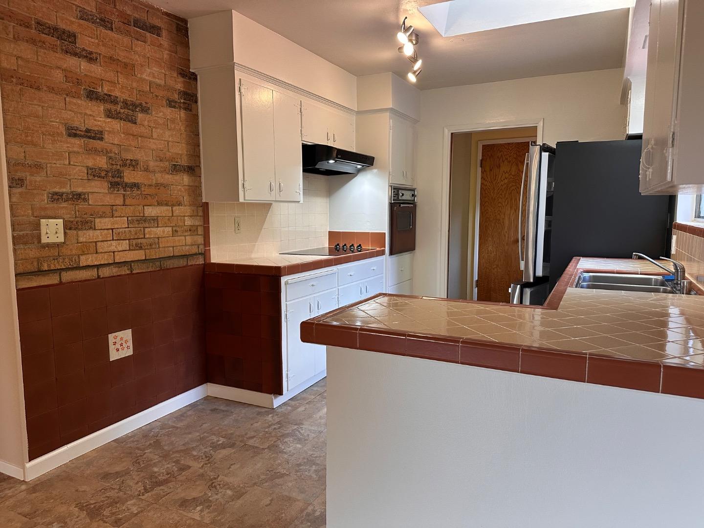 46 Valley View Road Watsonville, CA 95076 - Photo 27 of 55 a kitchen with stainless steel appliances granite countertop a refrigerator and a sink