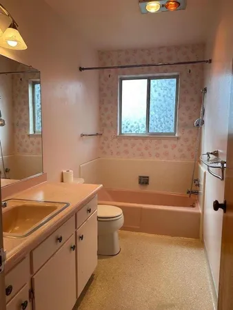 a kitchen that has a sink and a stove