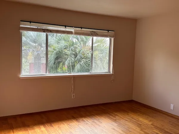a view of empty room with a fireplace