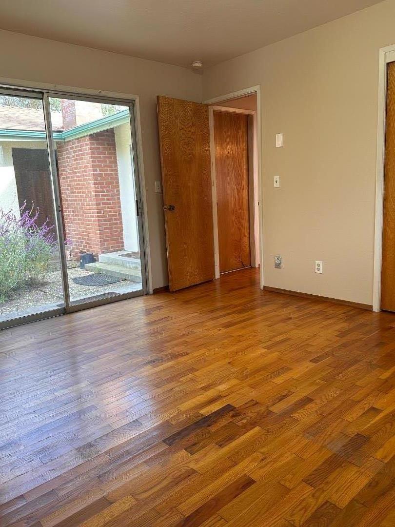 46 Valley View Road Watsonville, CA 95076 - Photo 54 of 55 a view of an empty room with wooden floor and a window
