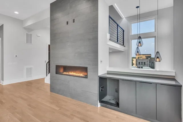 a kitchen with stainless steel appliances granite countertop a stove and a refrigerator