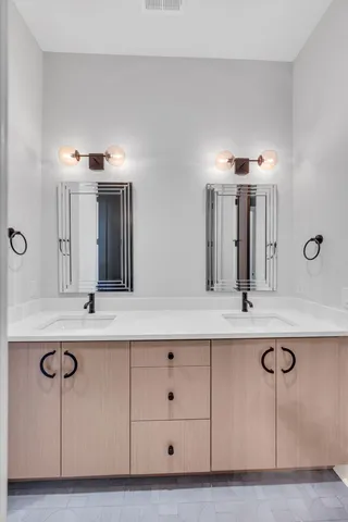 an empty room with wooden floor and balcony