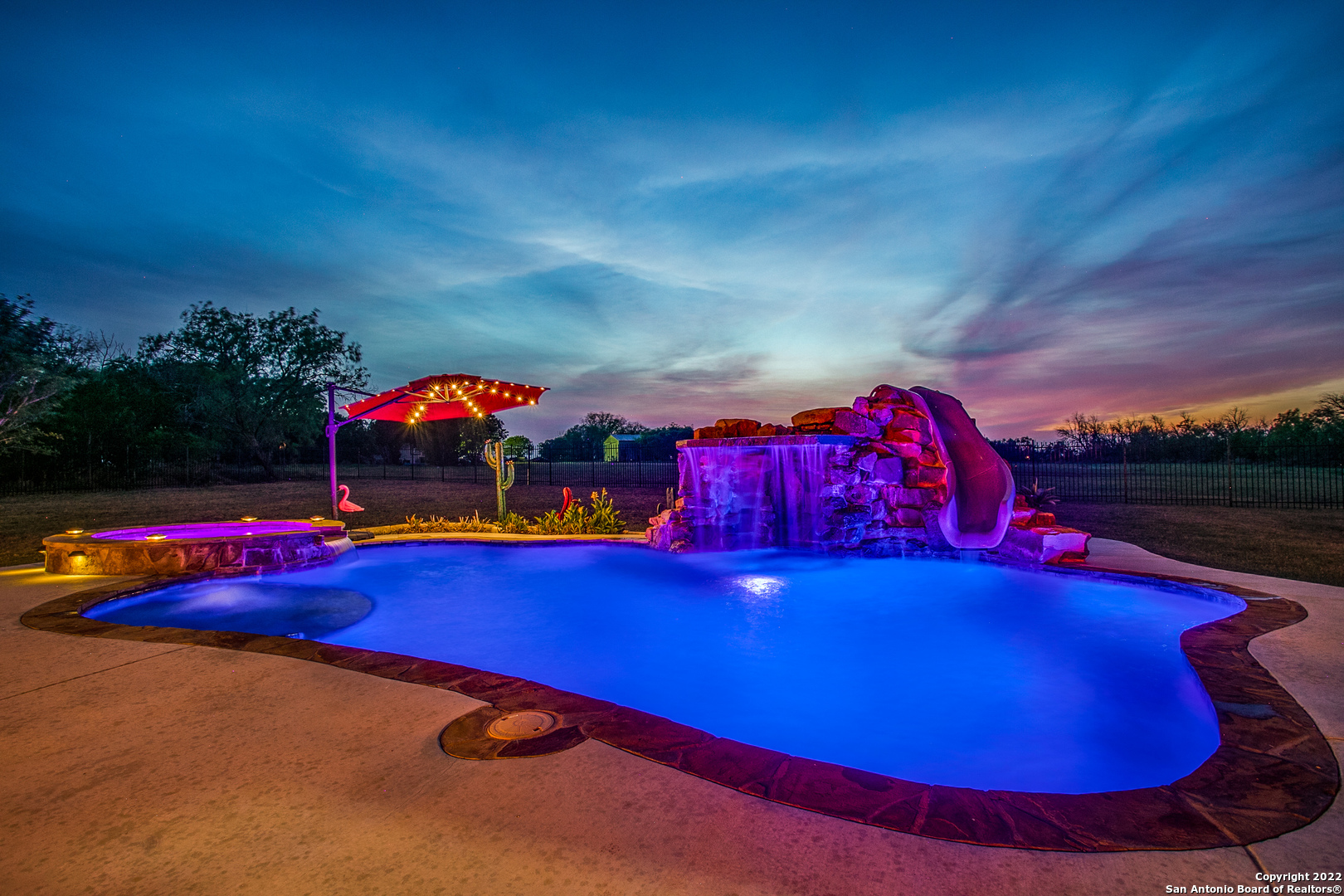 a view of a pool with seating area