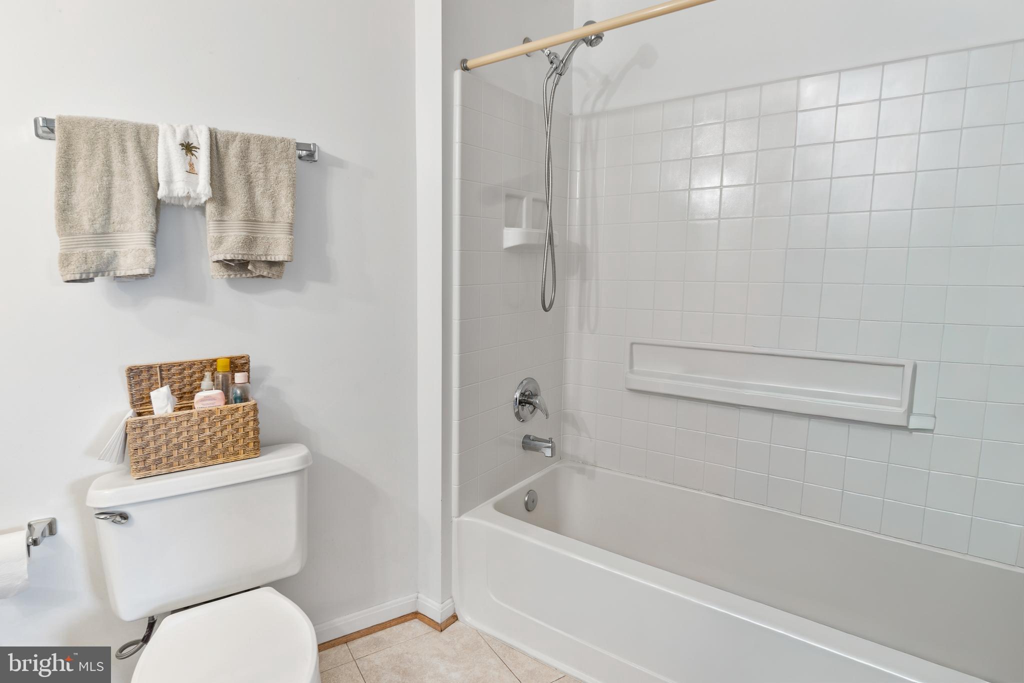 2900 North Leisure World Boulevard, Unit 301 Silver Spring, MD 20906 - Photo 13 of 30 a bathroom with a toilet and a shower