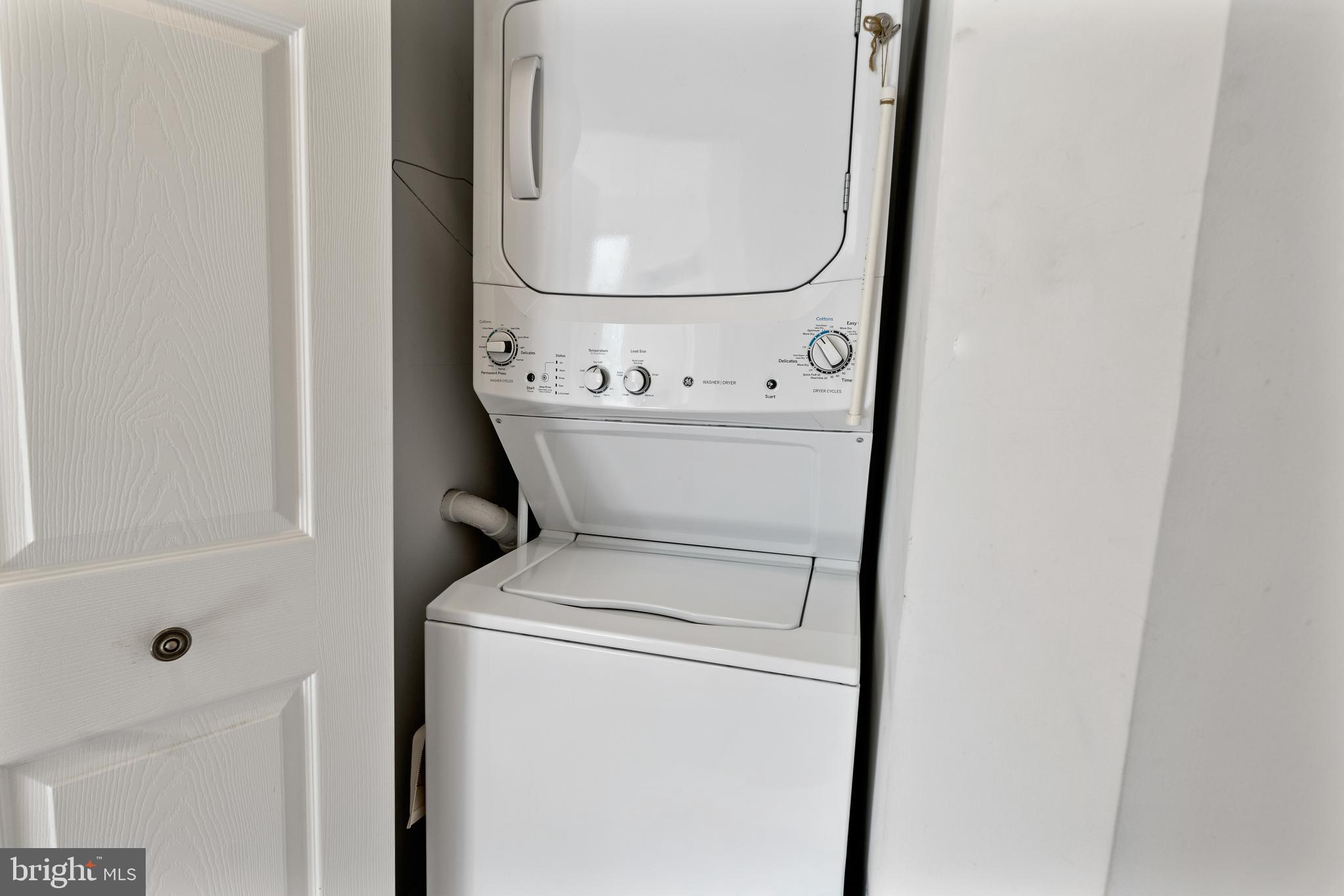 2900 North Leisure World Boulevard, Unit 301 Silver Spring, MD 20906 - Photo 17 of 30 a utility room with dryer and washer