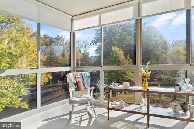 a view of a room with workspace and windows