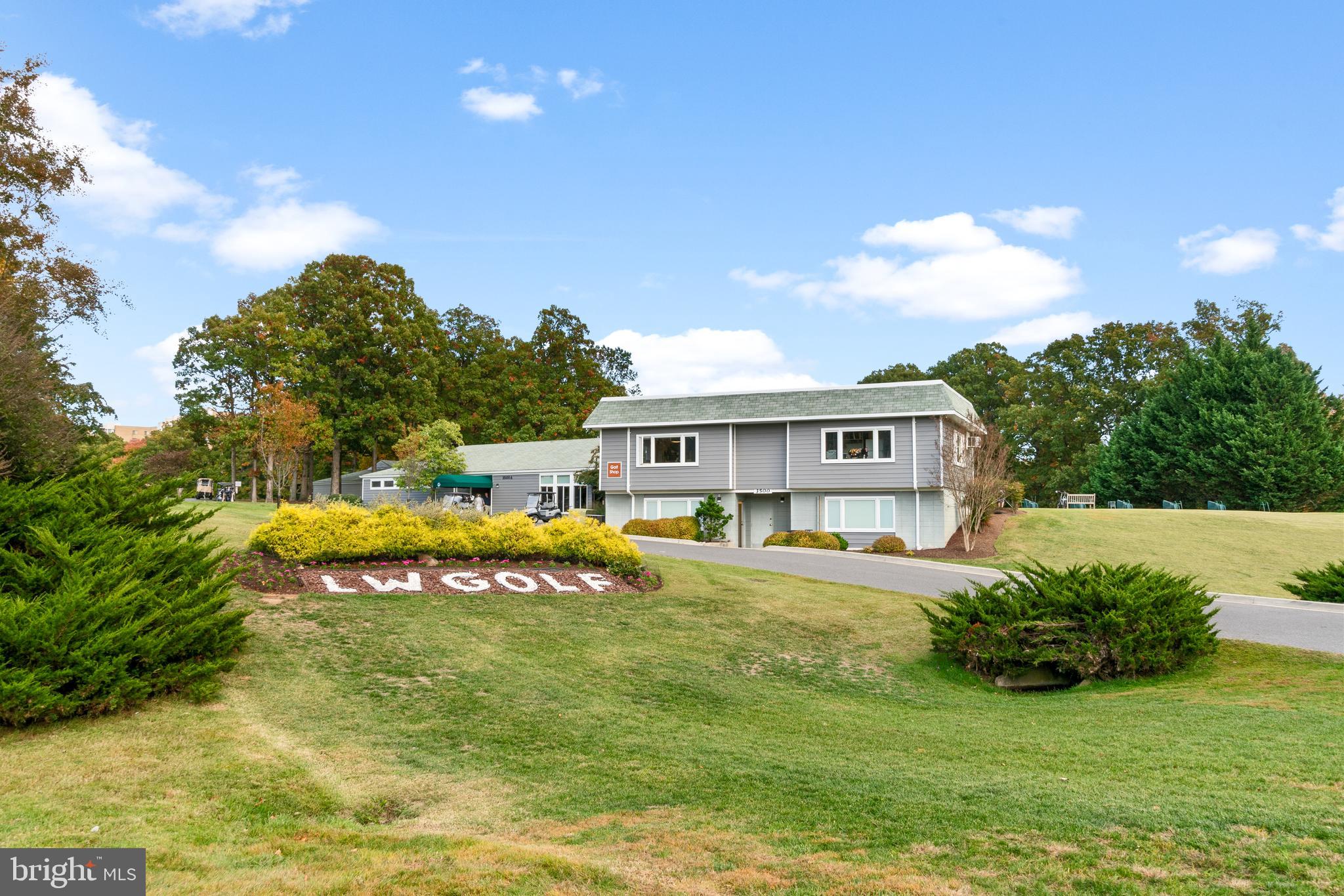 2900 North Leisure World Boulevard, Unit 301 Silver Spring, MD 20906 - Photo 22 of 30 a house view with swimming pool and trees in the background