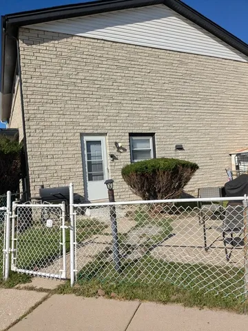 a brick house with a yard