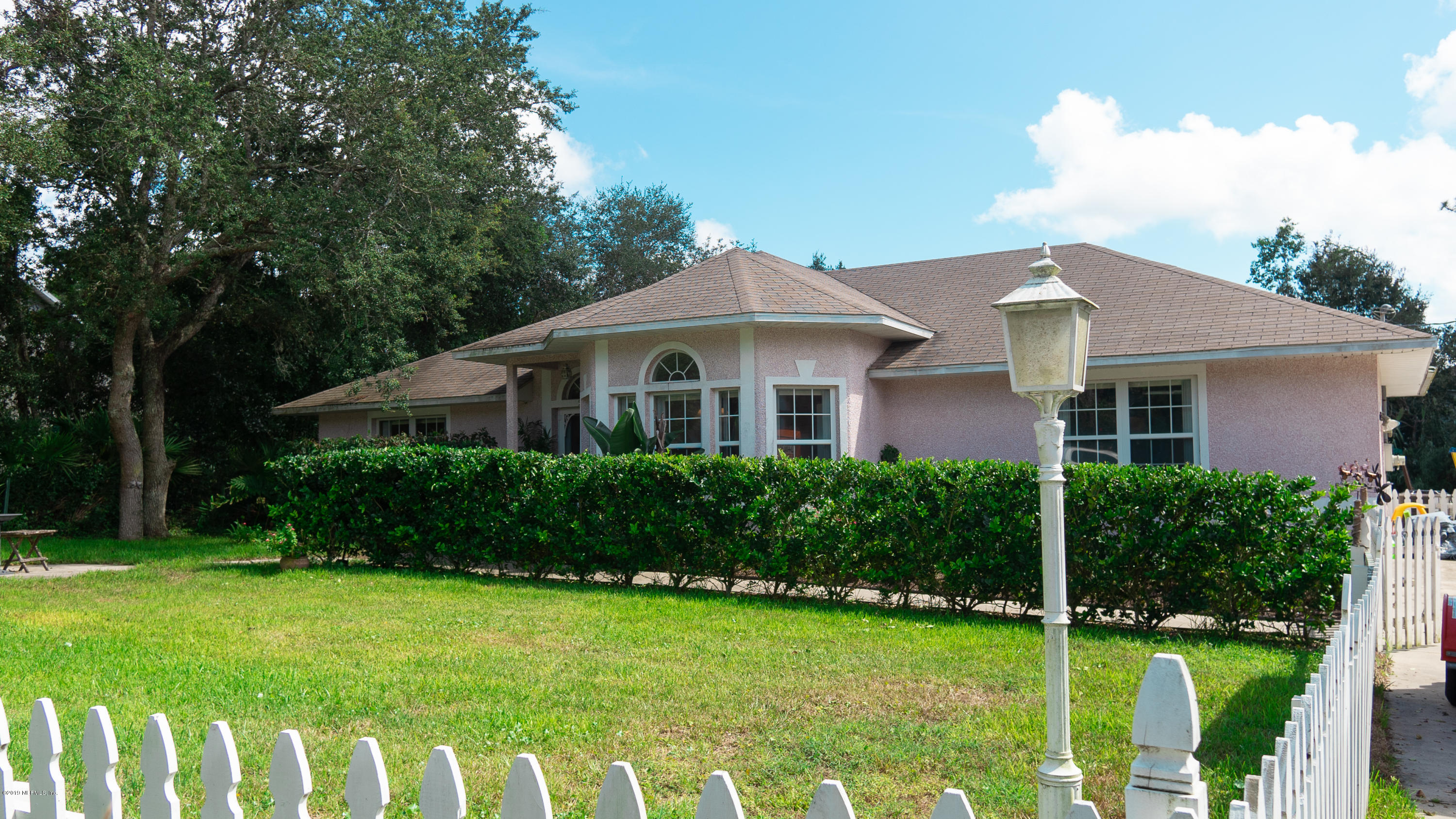 570 Ruba Road St. Augustine, FL 32086 - Photo 1 of 27 a front view of a house with a yard