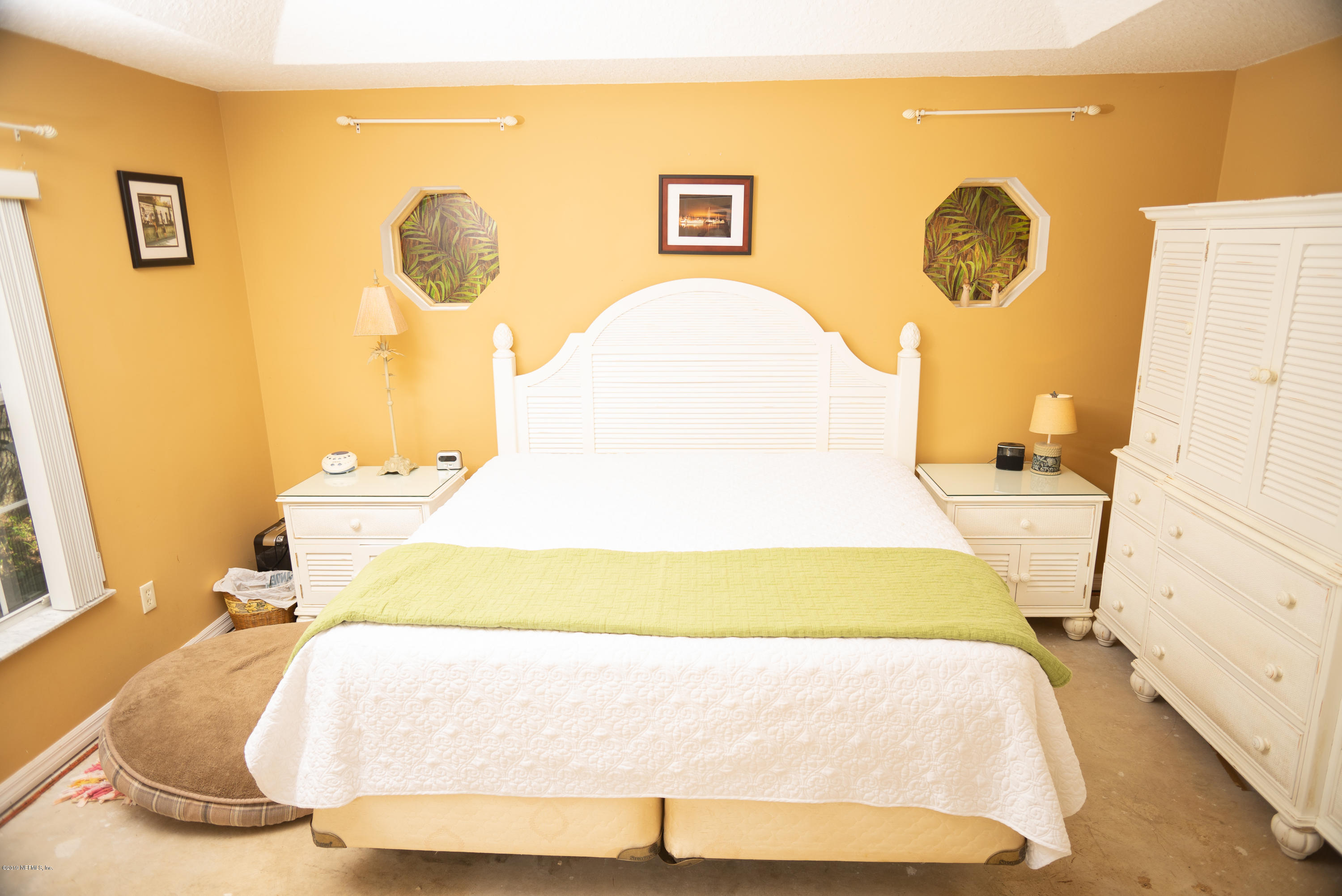 570 Ruba Road St. Augustine, FL 32086 - Photo 14 of 27 a bedroom with a bed and a window