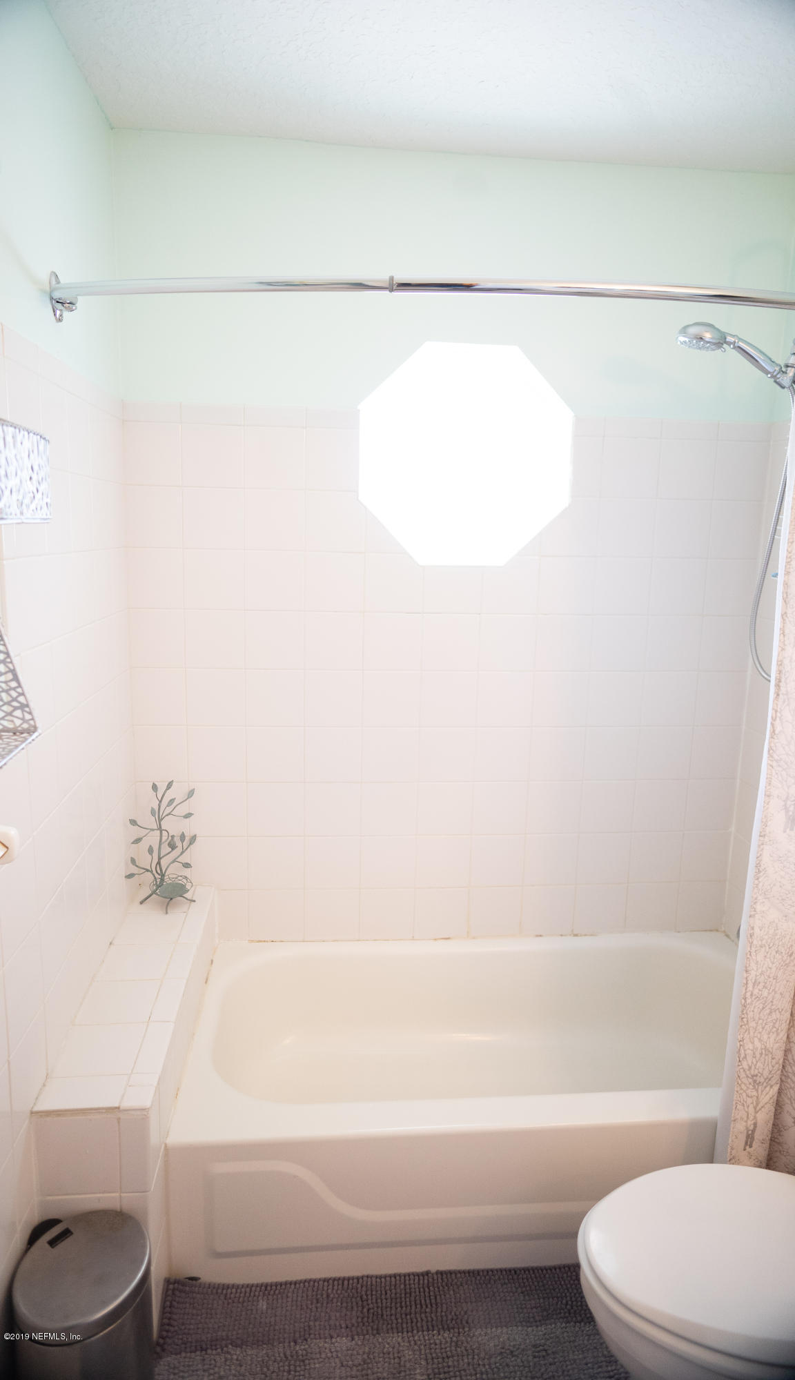 570 Ruba Road St. Augustine, FL 32086 - Photo 18 of 27 a bathroom with a toilet and a bathtub