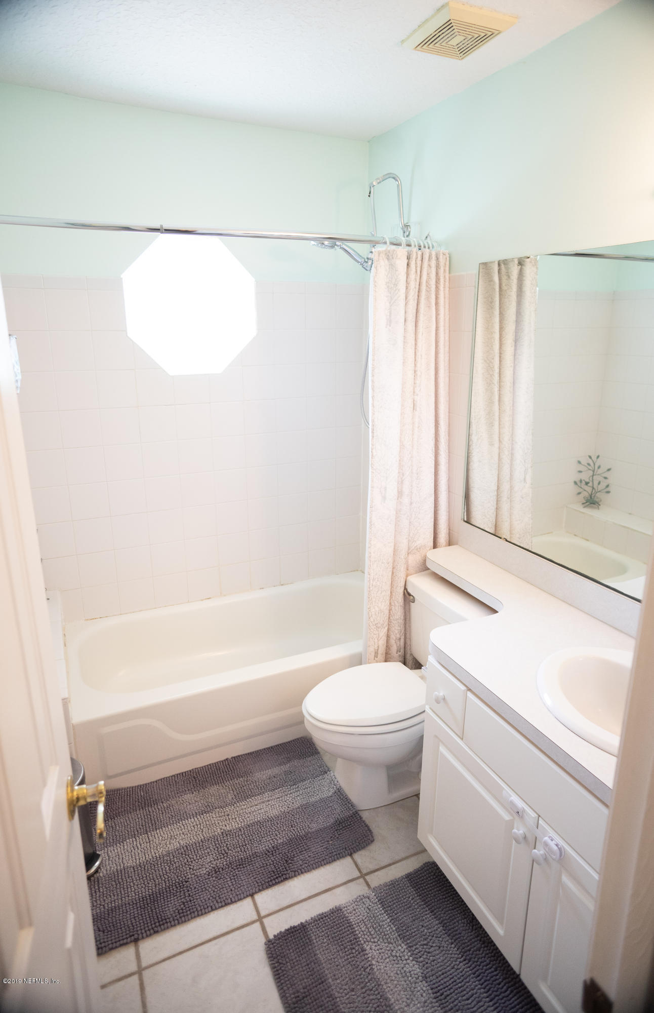 570 Ruba Road St. Augustine, FL 32086 - Photo 19 of 27 a bathroom with a sink toilet and shower
