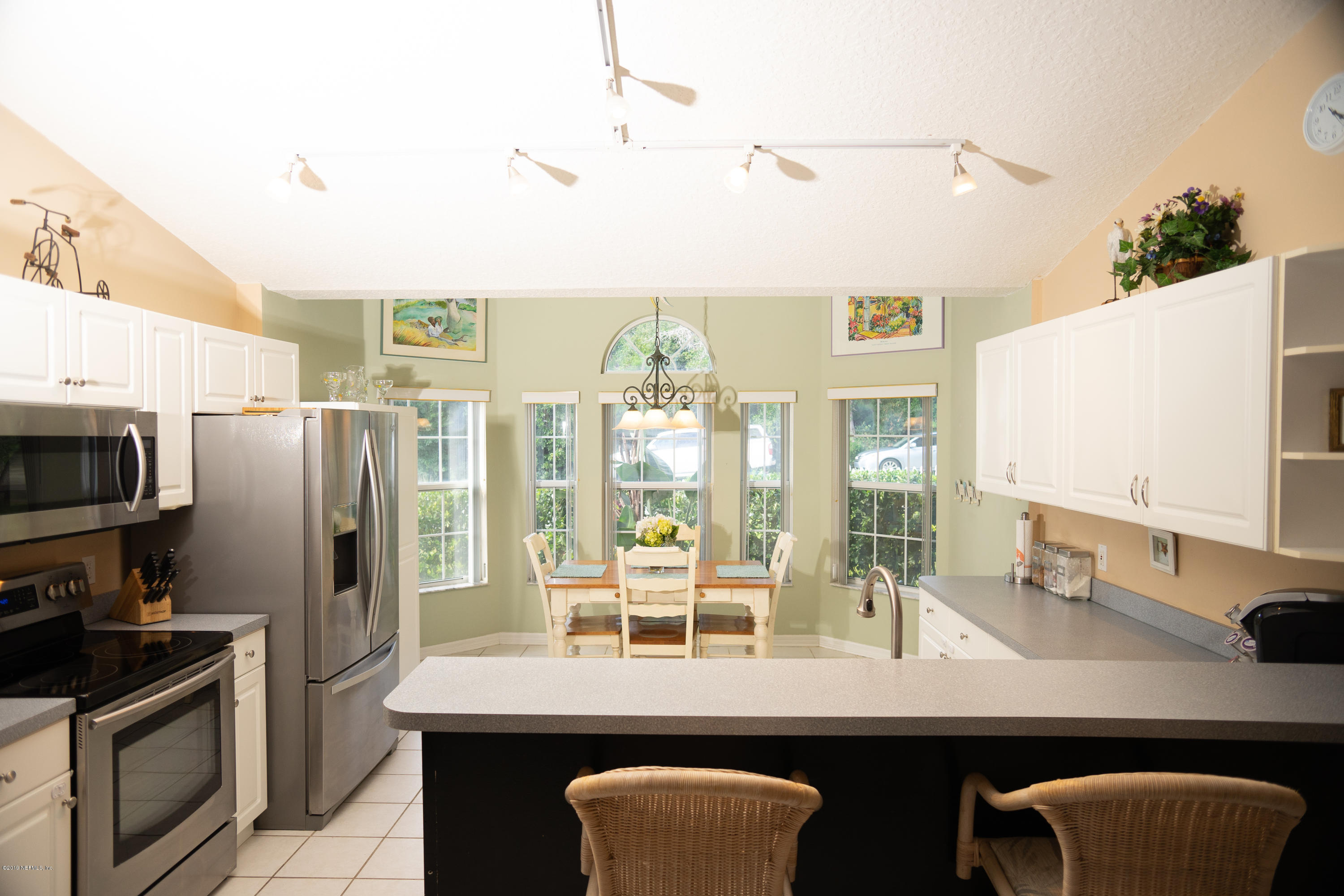570 Ruba Road St. Augustine, FL 32086 - Photo 7 of 27 a kitchen with stainless steel appliances a sink and a refrigerator