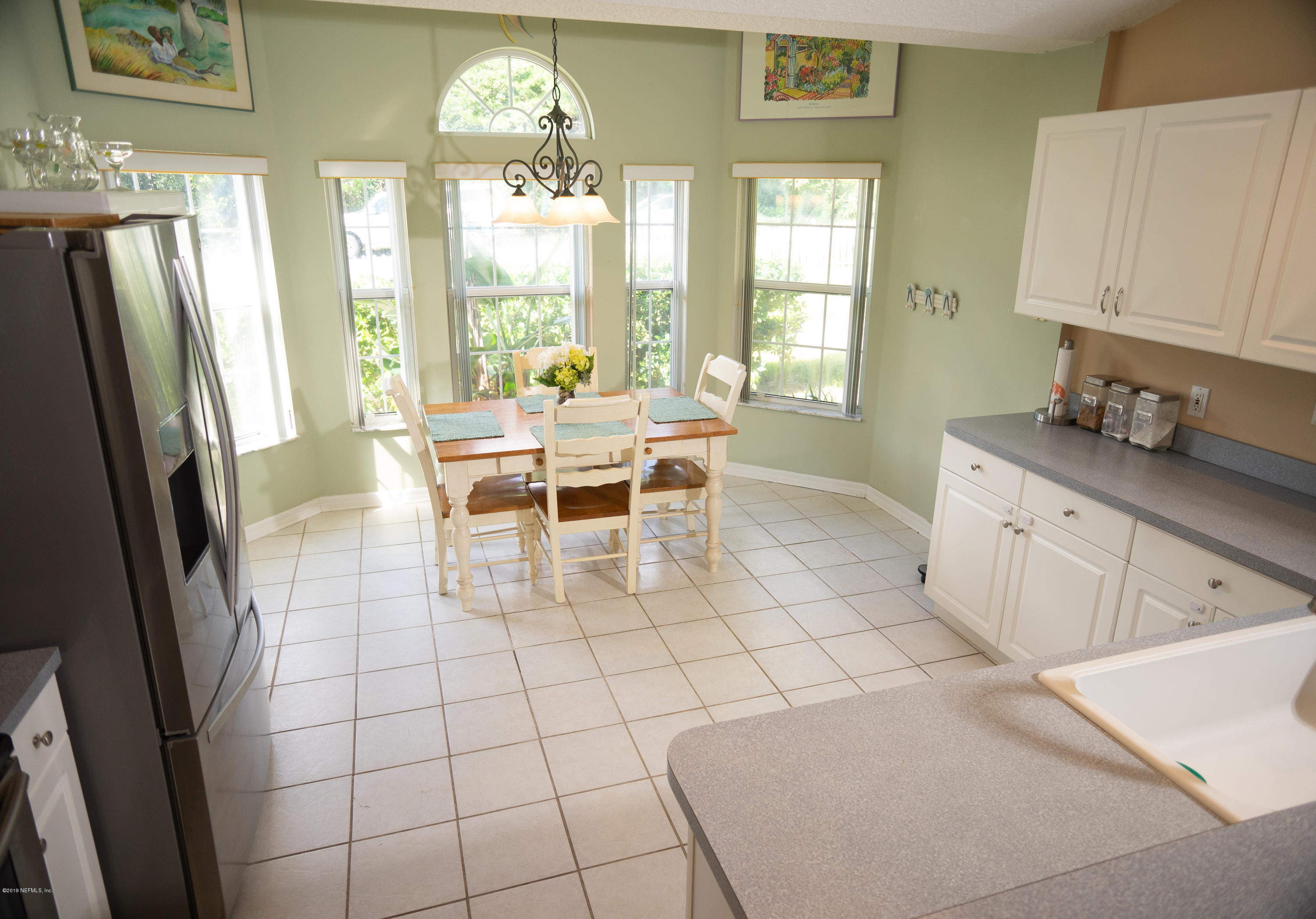 570 Ruba Road St. Augustine, FL 32086 - Photo 8 of 27 a view of a kitchen with fridge and window