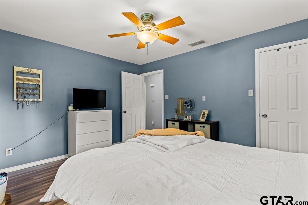 2144 State Highway 155 Gilmer, TX 75644 - Photo 11 of 26 a bedroom with a bed and a flat screen tv