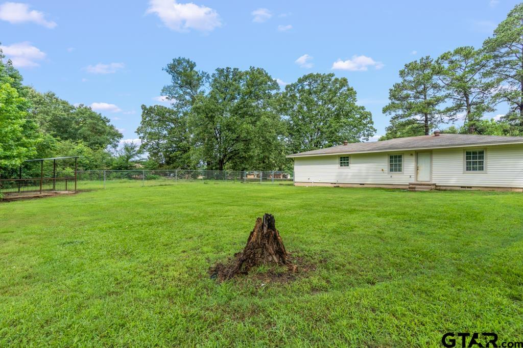 2144 State Highway 155 Gilmer, TX 75644 - Photo 19 of 26 a view of a house with a yard