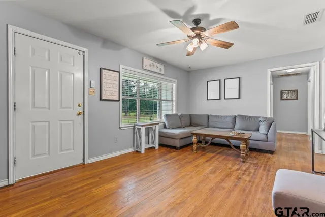 a living room with furniture and a large window