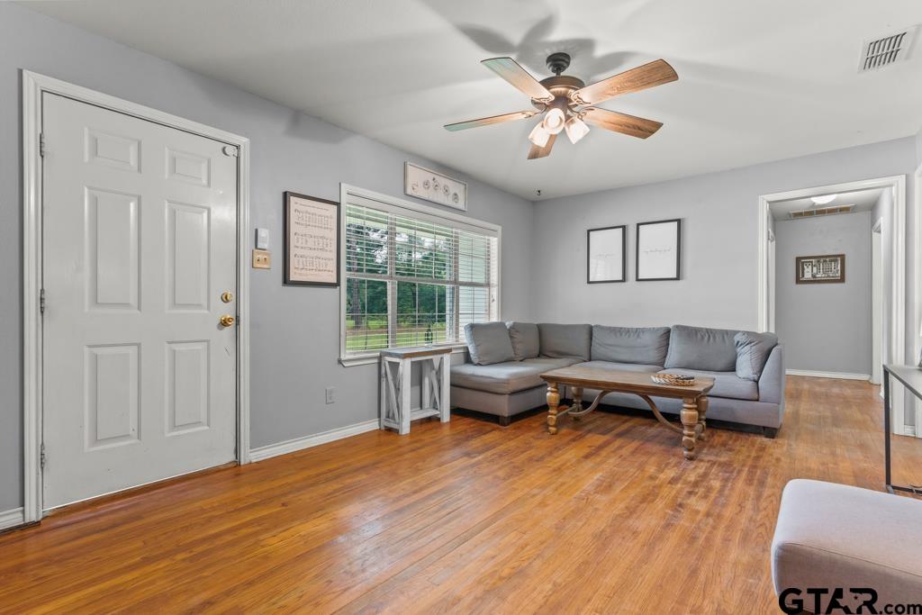2144 State Highway 155 Gilmer, TX 75644 - Photo 2 of 26 a living room with furniture and a large window