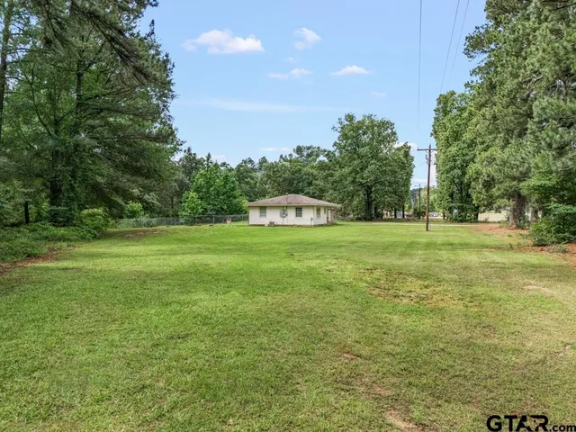 a building with trees in the background