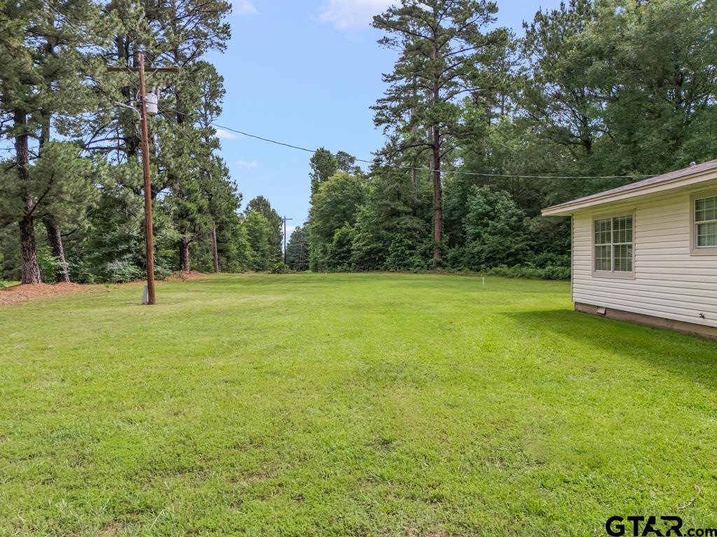 2144 State Highway 155 Gilmer, TX 75644 - Photo 24 of 26 a view of a house with a yard