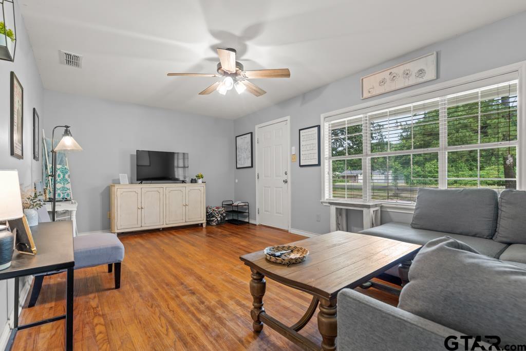 2144 State Highway 155 Gilmer, TX 75644 - Photo 4 of 26 a living room with furniture and a flat screen tv