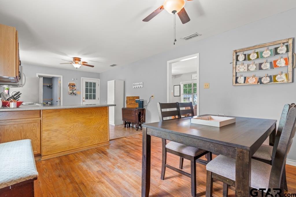 2144 State Highway 155 Gilmer, TX 75644 - Photo 6 of 26 a view of a dining room with furniture and a chandelier