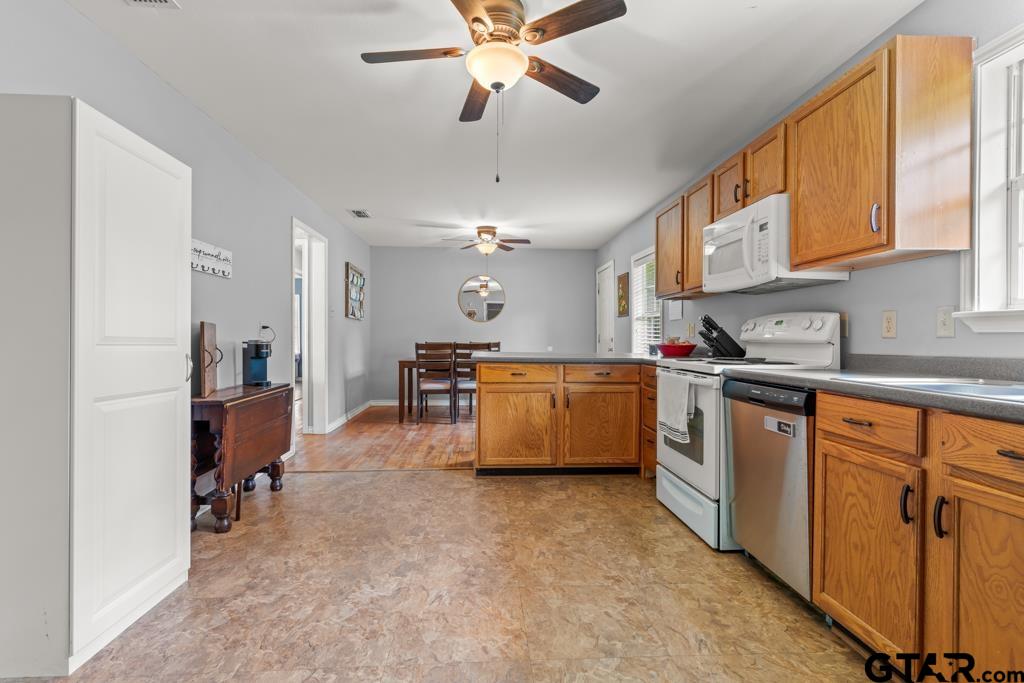 2144 State Highway 155 Gilmer, TX 75644 - Photo 9 of 26 a kitchen with cabinets a sink and appliances