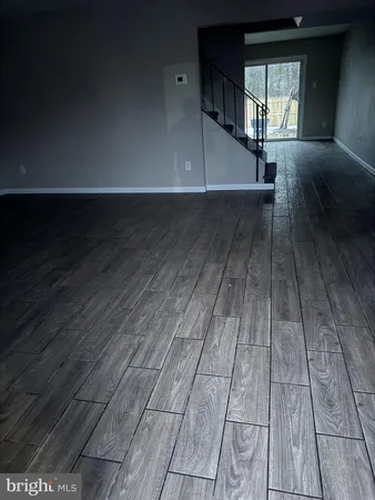 a view of entryway with wooden floor