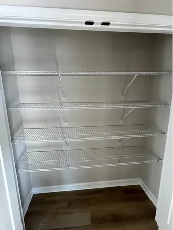 a view of a room with racks on the wall