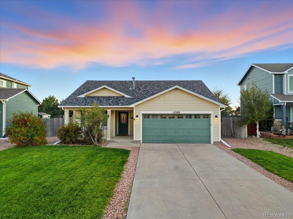 front view of a house with a yard