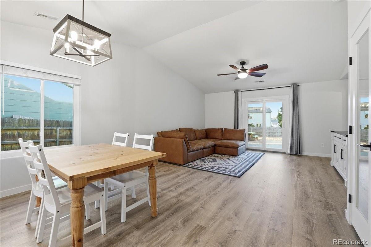 12209 Crystal Downs Road Peyton, CO 80831 - Photo 12 of 37 a living room with furniture and a table