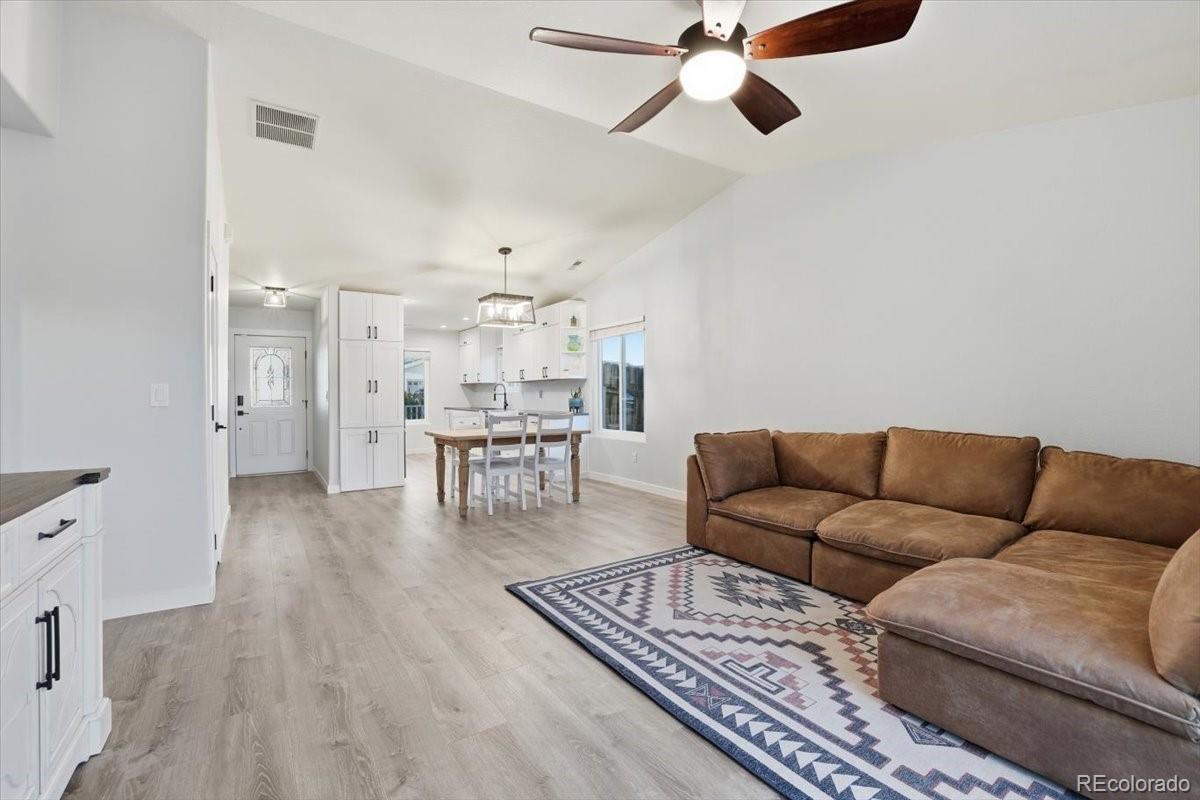 12209 Crystal Downs Road Peyton, CO 80831 - Photo 14 of 37 a living room with furniture and a rug
