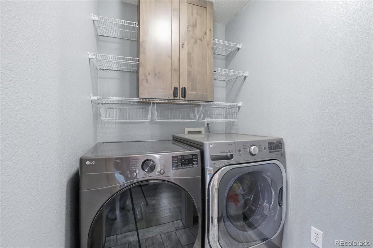 12209 Crystal Downs Road Peyton, CO 80831 - Photo 16 of 37 a utility room with dryer and washer