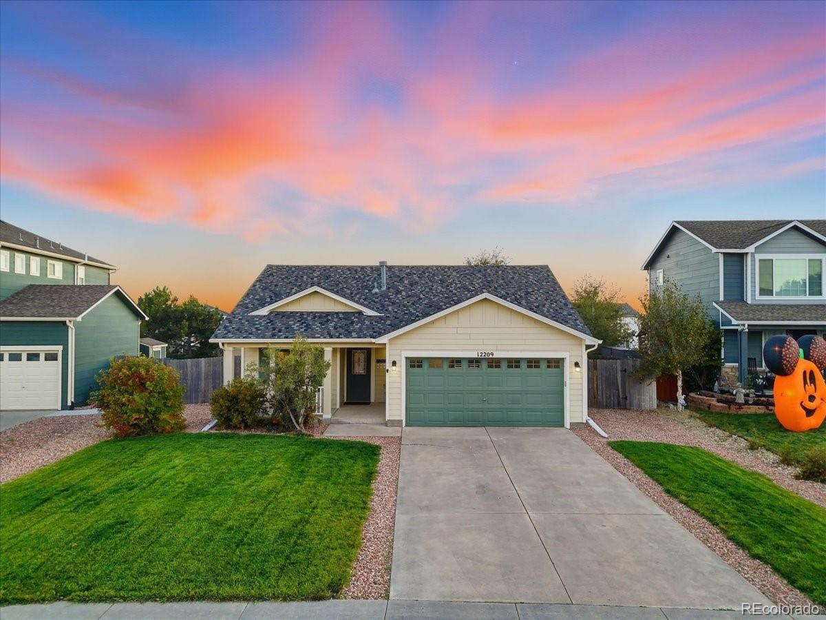 12209 Crystal Downs Road Peyton, CO 80831 - Photo 17 of 37 front view of a house with a yard