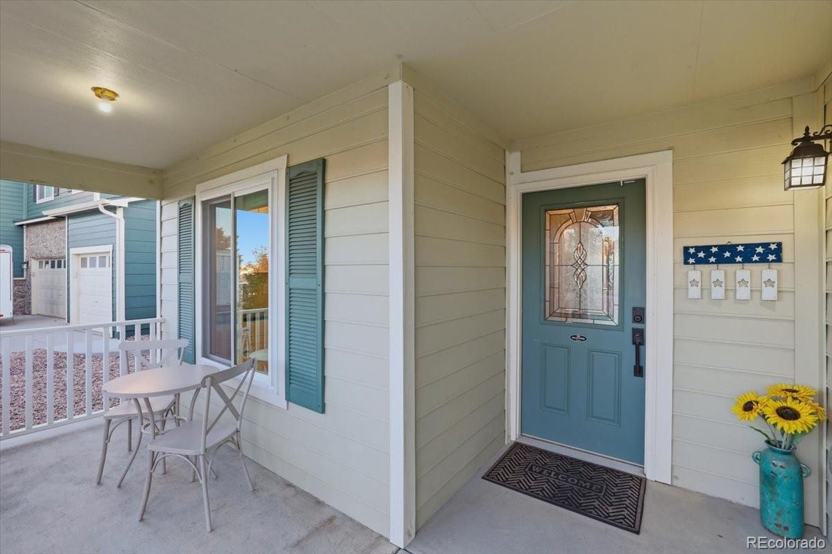 12209 Crystal Downs Road Peyton, CO 80831 - Photo 18 of 37 a view of a hallway and dining room with a table and chairs