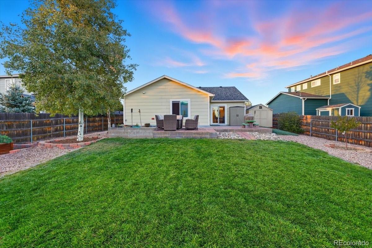 12209 Crystal Downs Road Peyton, CO 80831 - Photo 19 of 37 a view of a house with a yard and sitting area