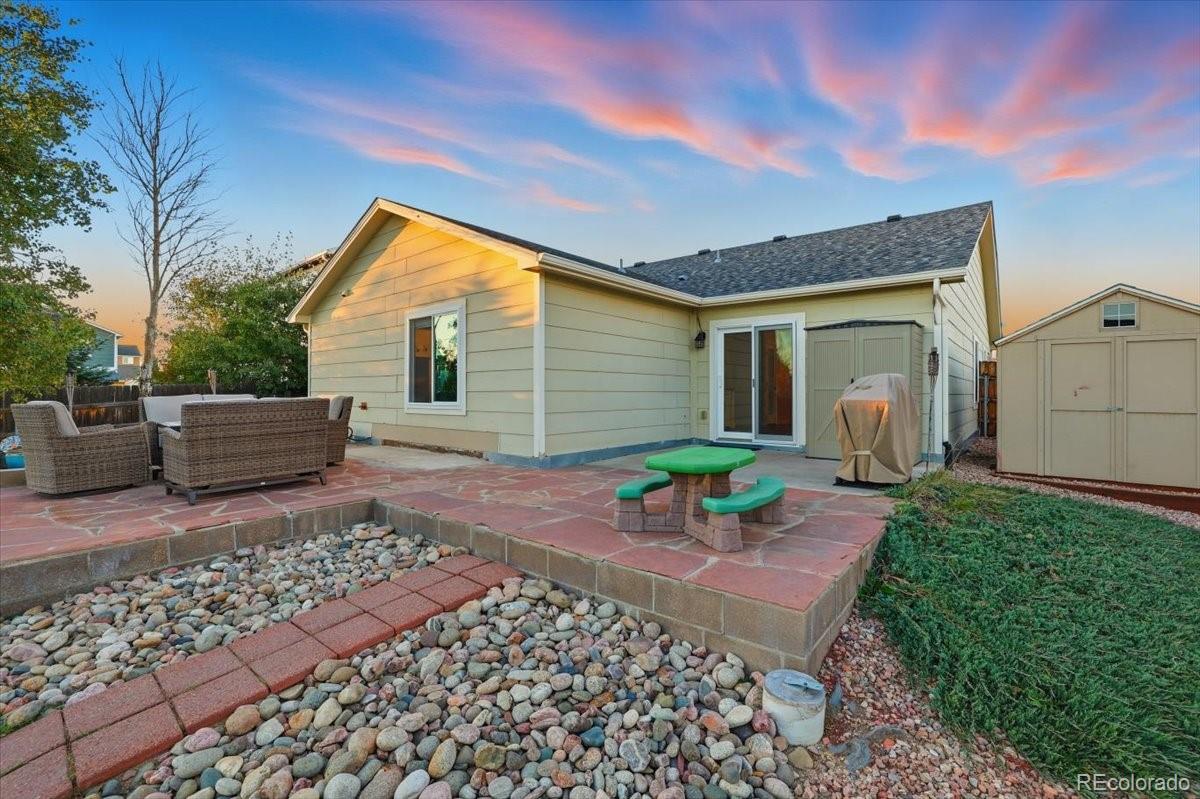12209 Crystal Downs Road Peyton, CO 80831 - Photo 21 of 37 a front view of a house with garden