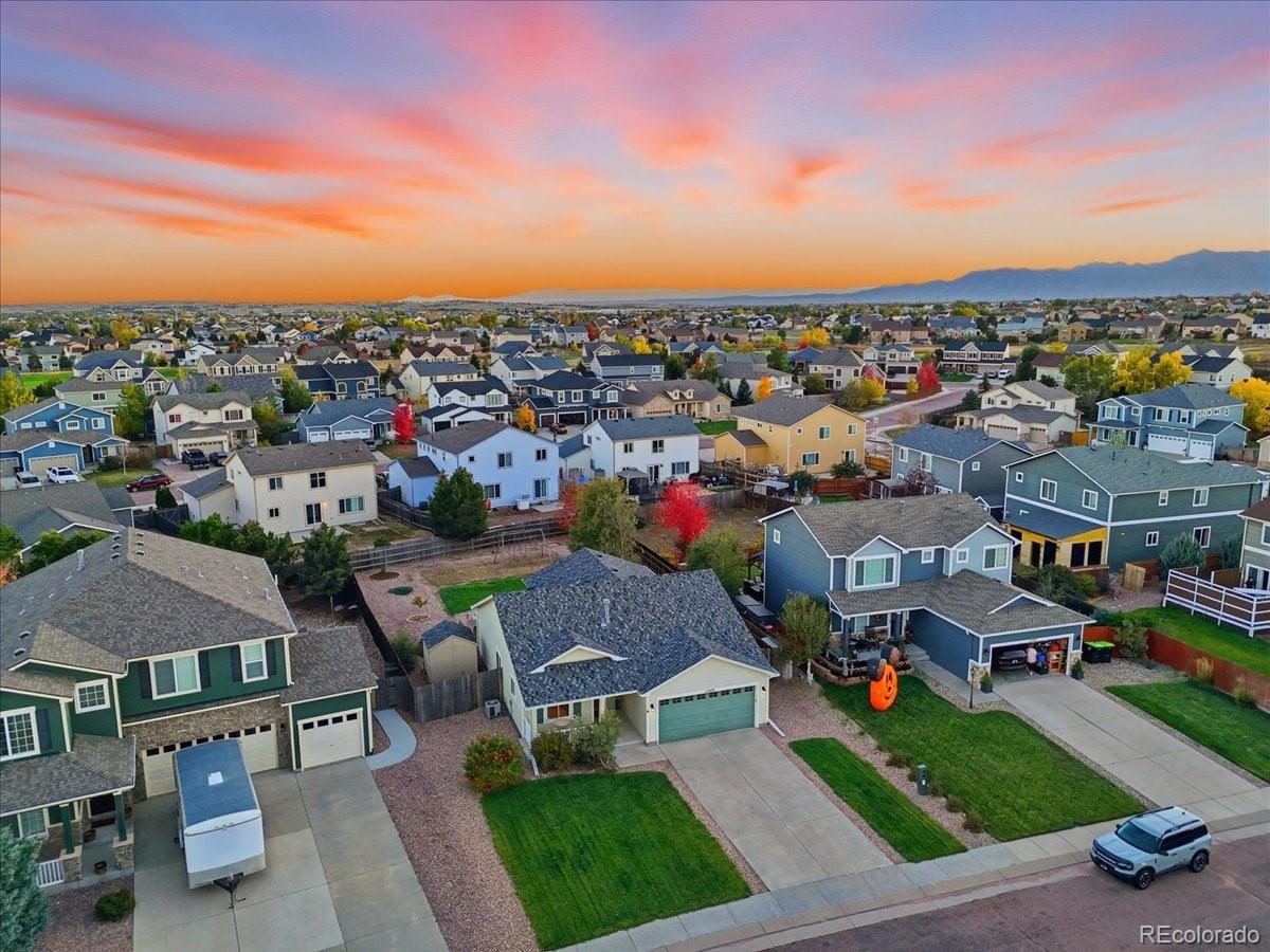 12209 Crystal Downs Road Peyton, CO 80831 - Photo 31 of 37 a view of a city with lots of cars parked