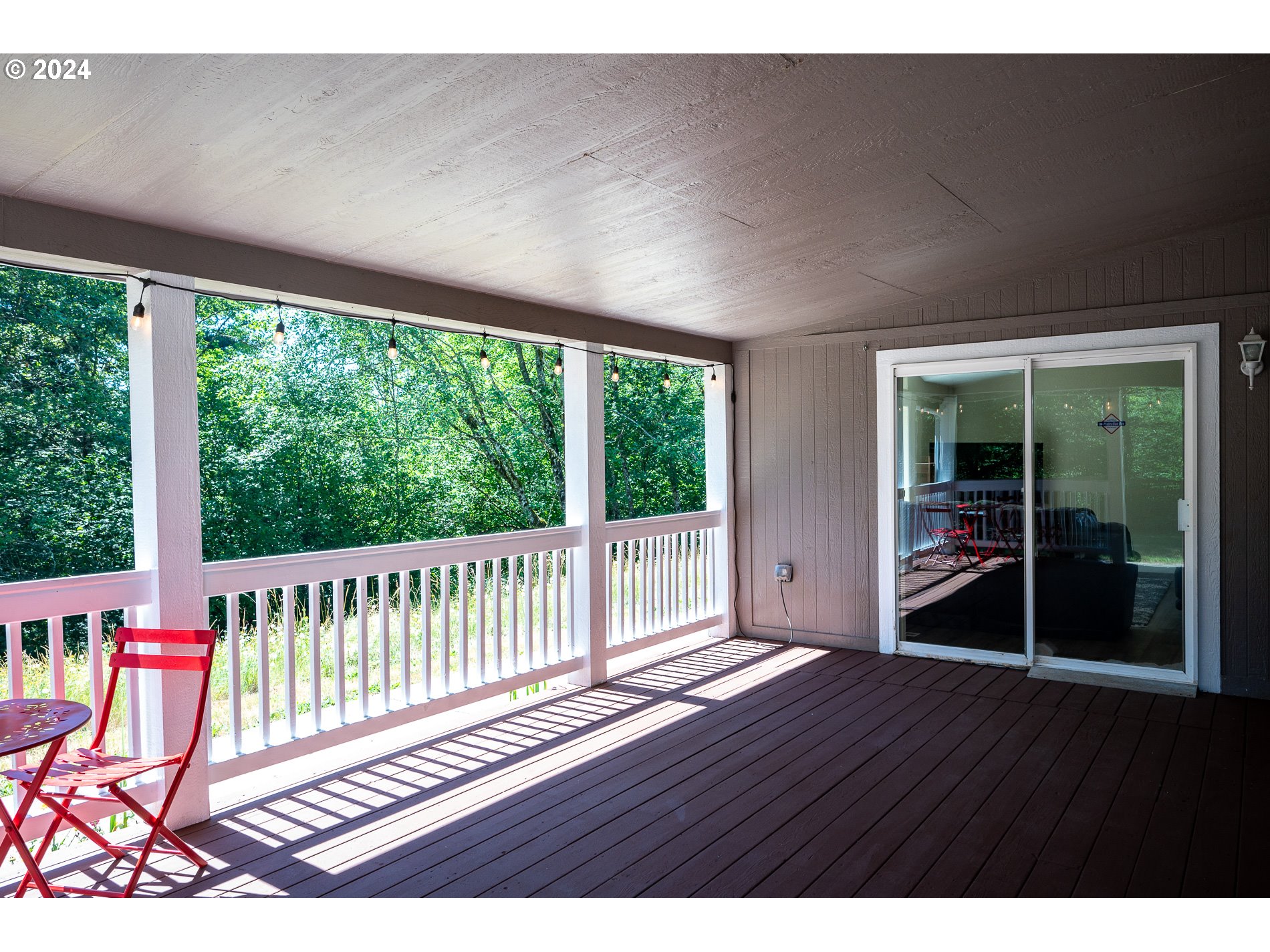 6007 Northeast Lessard Road Camas, WA 98607 - Photo 11 of 48 a view of an empty room with wooden floor and windows