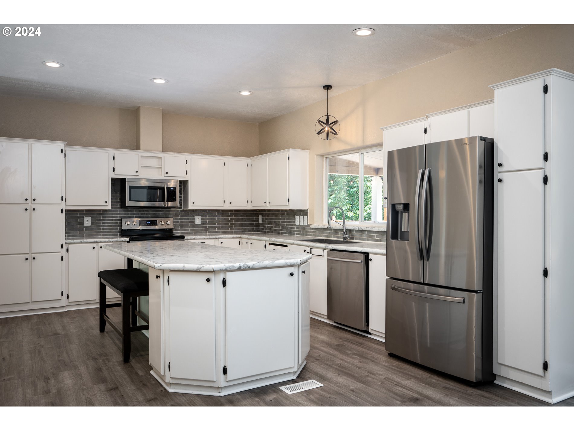 6007 Northeast Lessard Road Camas, WA 98607 - Photo 17 of 48 a kitchen with stainless steel appliances a refrigerator stove microwave and cabinets