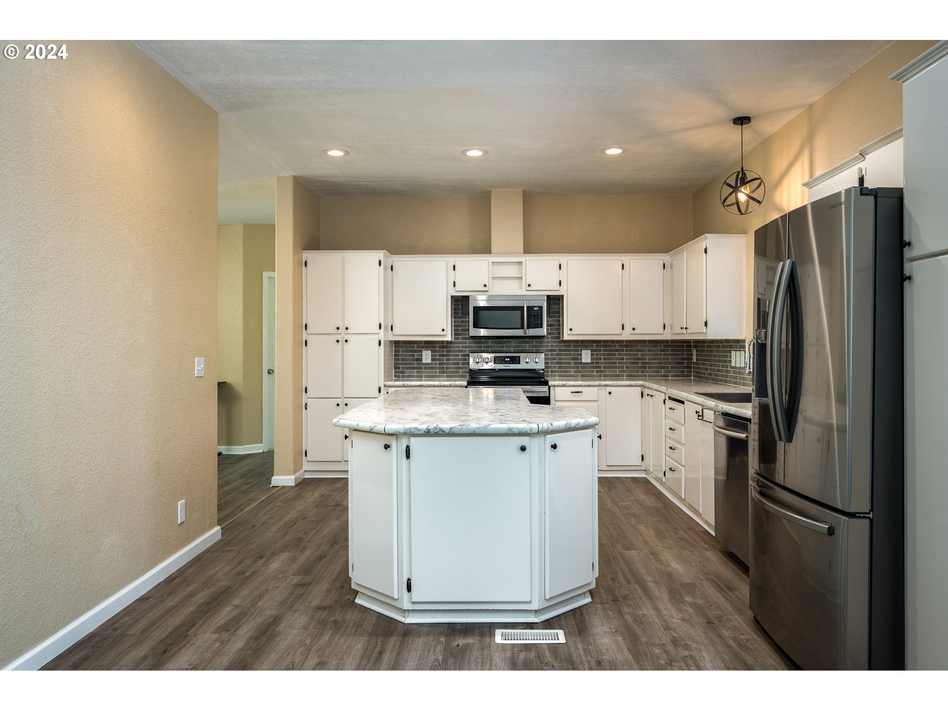 6007 Northeast Lessard Road Camas, WA 98607 - Photo 18 of 48 a kitchen with stainless steel appliances a refrigerator stove microwave and cabinets