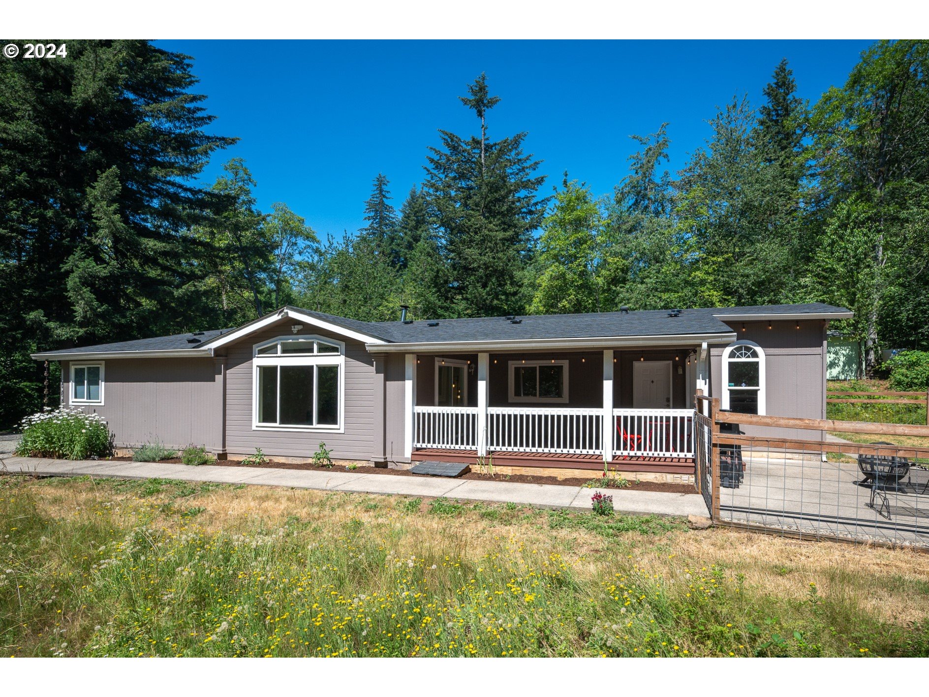 6007 Northeast Lessard Road Camas, WA 98607 - Photo 2 of 48 a house with trees in the background
